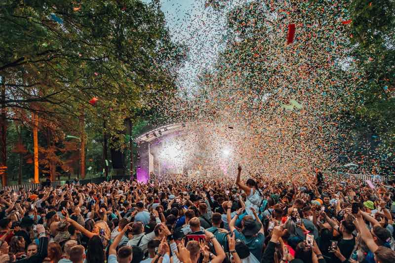 Fans dancing with confetti at Forbidden Forest Festival